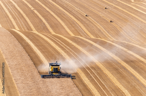 Crop havesting with a combine on a dry sunny day