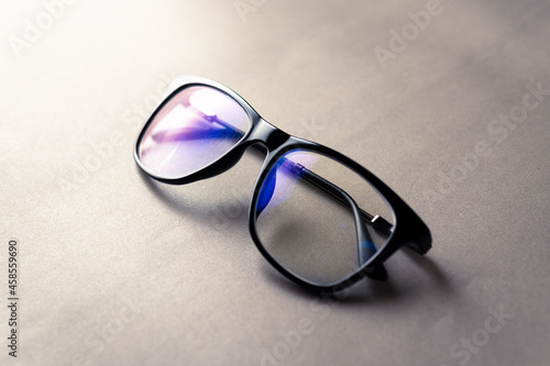 Fotografie black frame blue light blocking technology anti glare spectacles glasses on grey