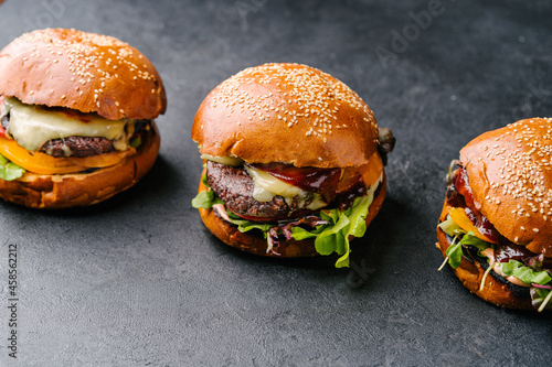 fresh tasty meat free burgers on wooden table. Copy space photo