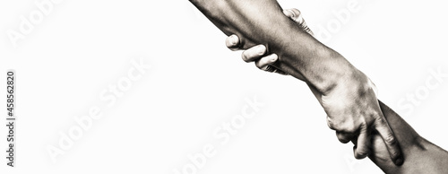Close up help hand. Helping hand concept, support. Helping hand outstretched, isolated arm, salvation. Two hands, helping arm of a friend, teamwork. Rescue, helping gesture or hands. Copy space photo