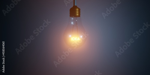 IDEA text inside of hanging and glowing 3D light bulb concept rendering illustration. Tungsten light blulb with idea text inside. 