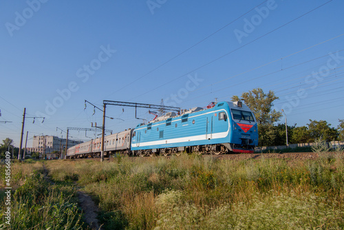 A passenger train moving on the tracks near the station Rostov-Main