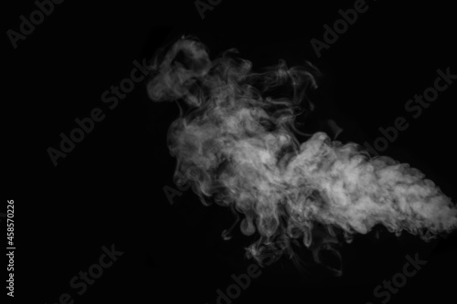 Curly white steam, Fog or smoke isolated transparent special effect on black background. Layout for collages.