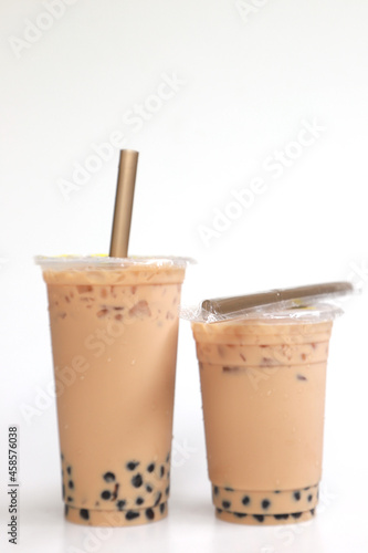Wallpaper Mural Two cups Ice milk tea with boba bubble big and small cup on white background Torontodigital.ca