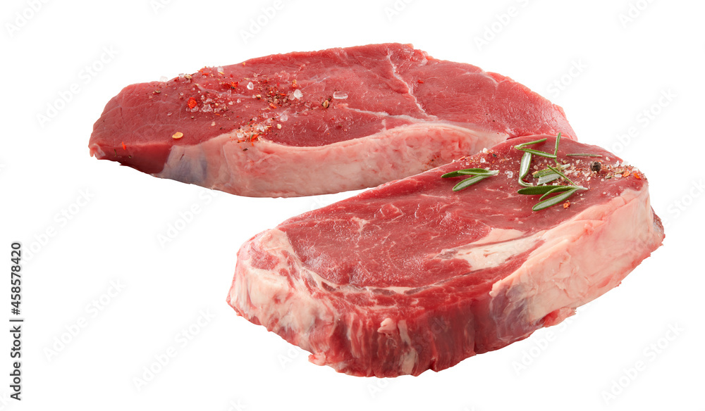 Fillet fresh raw beef meat rib eye tenderloin steak mix spice rosemary isolated on white background with cut out have clipping path Fillet fresh raw beef meat rib eye tenderloin steak mix spice rosemary isolated on white background with cut out have clipping path