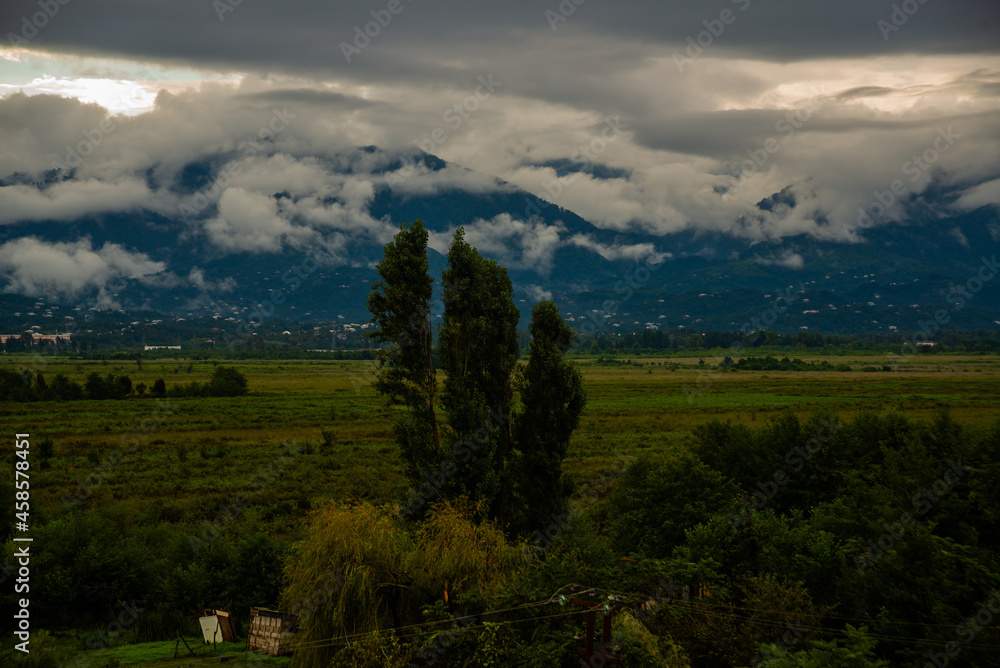 KOBULETI, GEORGIA: Top view of the Ispani marshes and mountains on a cloudy summer day. Unesco.