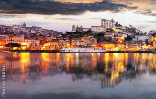  Porto at twilight with reflection in Douro river. Portugal