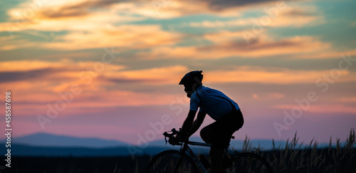 Fototapeta Naklejka Na Ścianę i Meble -  cyclist silhouette at sunset sports and fitness concept
