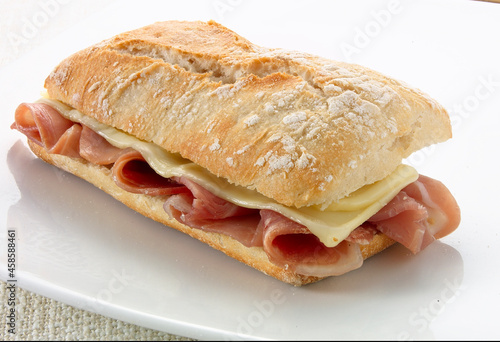 Baguette  de jamón y queso, sándwich, bocadillo. Ham and cheese baguette, sandwich, snack. photo