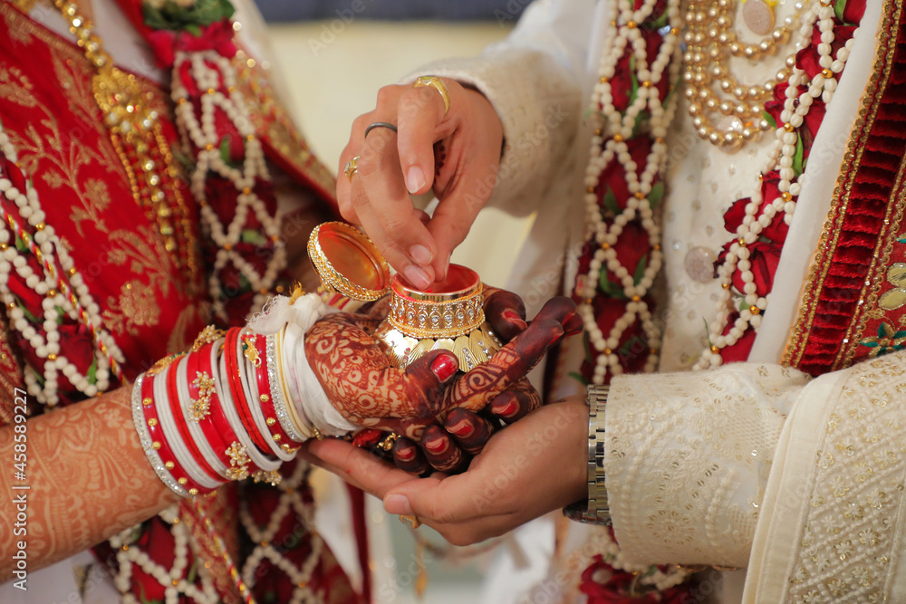 hands of a person with a sindur indian traditional ceremony | Indian wedding ceremony most important part of Indian wedding ceremony