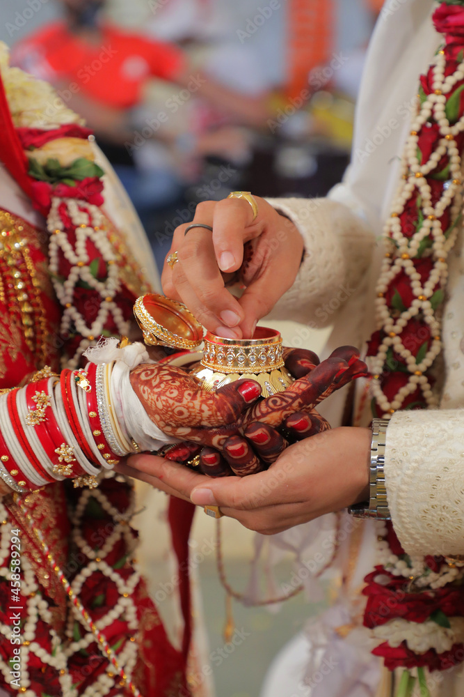 hands of a person with a sindur indian traditional ceremony | Indian wedding ceremony most important part of Indian wedding ceremony