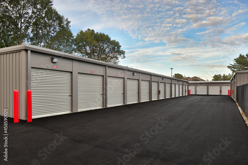 Modern warehouse garage storage facility under cloudy sky