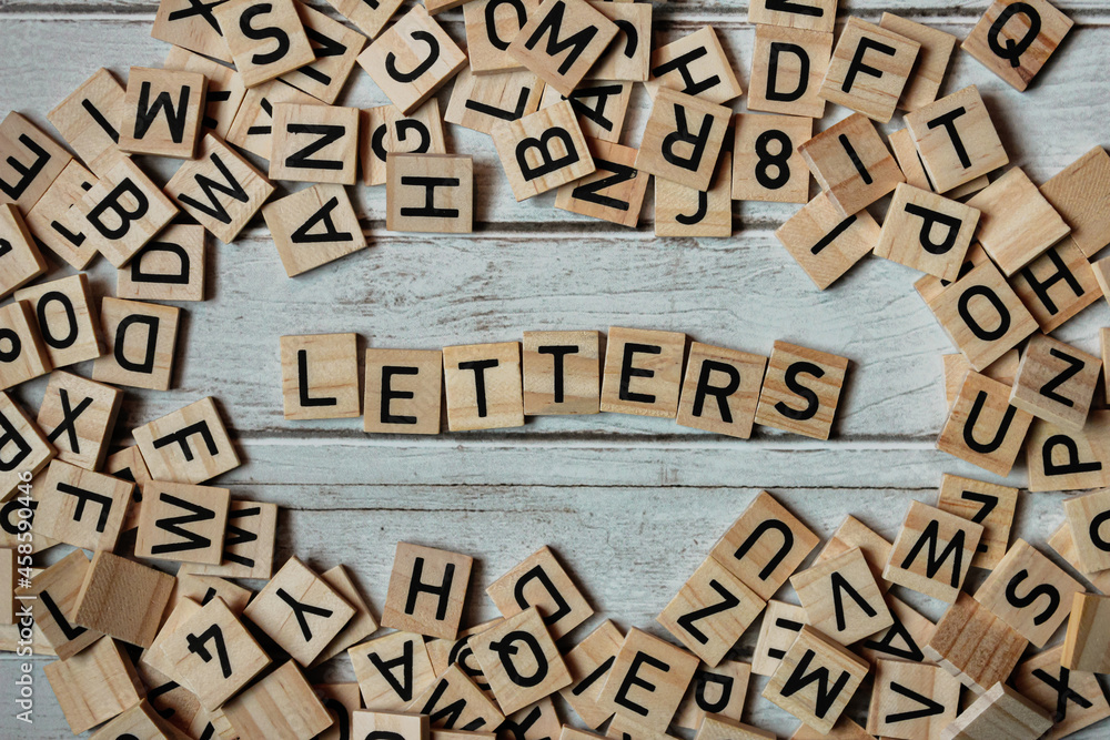 Word letters arranged on a wooden background Word letters arranged on a wooden background