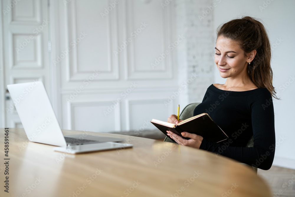 A student learns lessons online. Designer surf the Internet. The manager responds to clients by email. A woman is sitting in the office at home. Working on a computer remotely. A student learns lessons online. Designer surf the Internet. The manager responds to clients by email. A woman is sitting in the office at home. Working on a computer remotely.