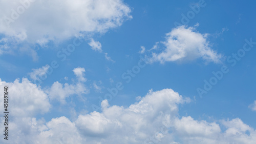 Cumulus clouds with blue sky on a sunny day of summer. Beautiful cloudscape as nature background panorama. Wonderful weather of natural daylight with white cloud floating  creating a abstract shape