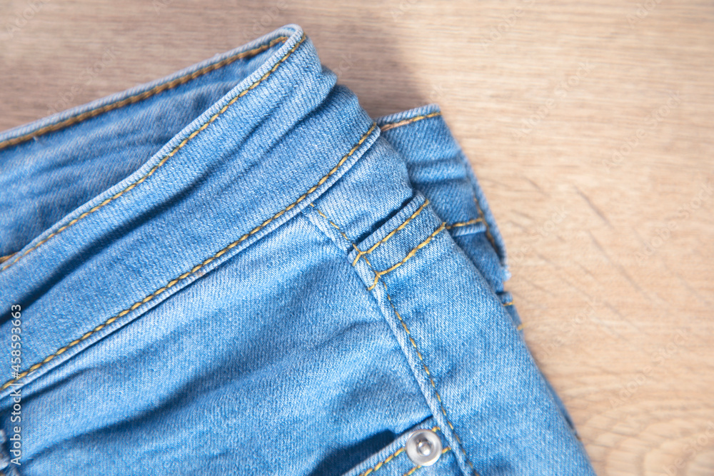 jeans on the wooden background jeans on the wooden background