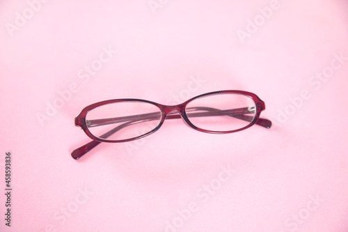 optic glasses on pink table