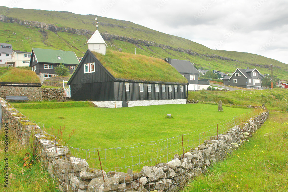 Typical Faroese wooden church standing close to the coast in Kollafjørður. Typical Faroese wooden church standing close to the coast in Kollafjørður.