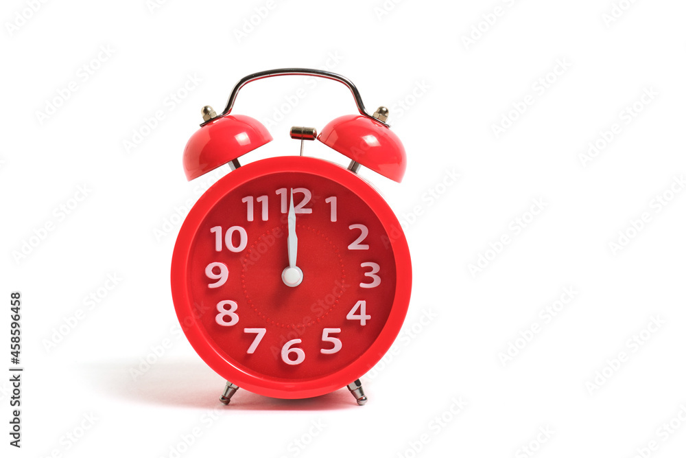 Red alarm clock is isolated on a white background, shows twelve clock, night and lunch time. Red alarm clock is isolated on a white background, shows twelve clock, night and lunch time.