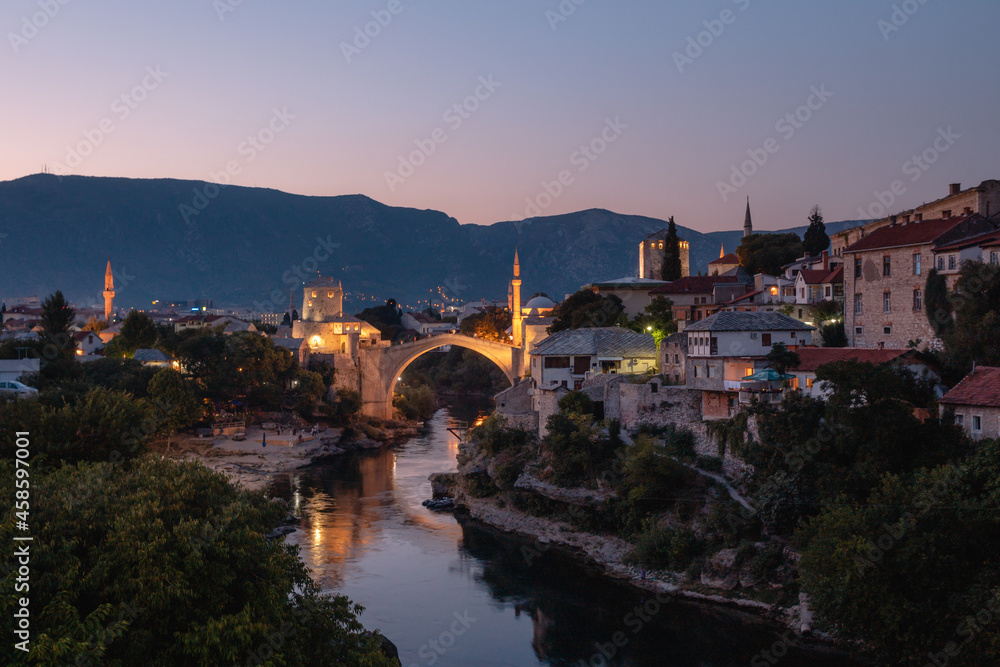 Mostar Bridge - Stari Most seen in the evening in summer, famous touristic destination in Bosnia and Herzegovina, Europe