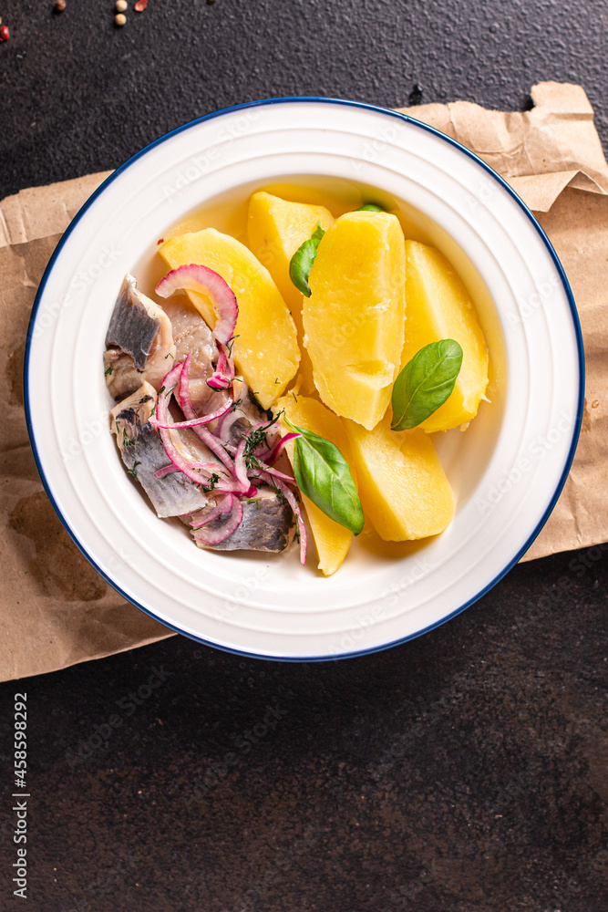 herring and potatoes boiled vegetable second course marinated fish onion fresh ready to eat meal snack on the table copy space food background 