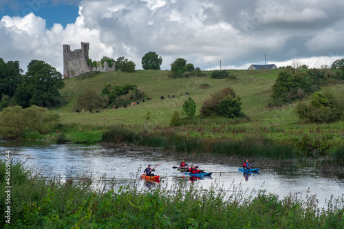 Kayaks on the river Boyne with Dunmoe castle in the background. Navan, Co. Meath, Ireland. September 19, 2021