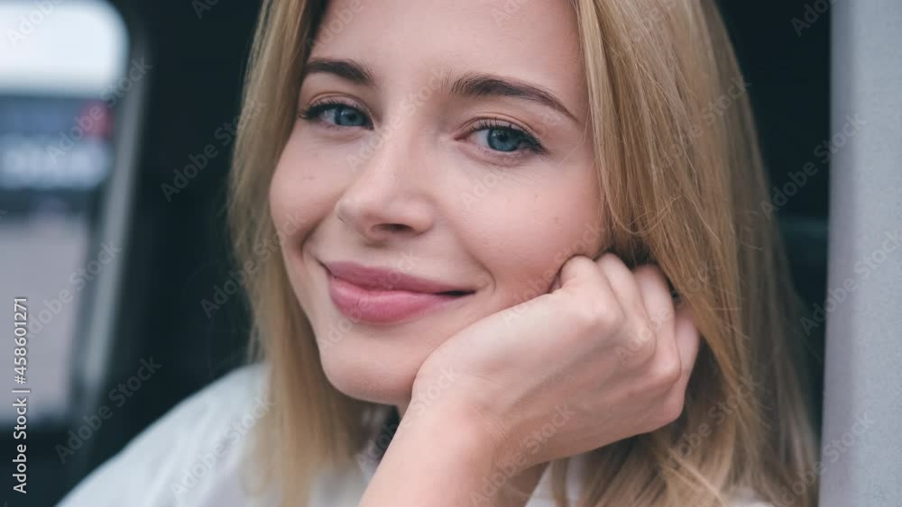 The attractive girl sitting at the car. slow motion The attractive girl sitting at the car. slow motion