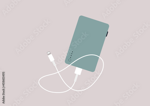 A power bank device with a mobile phone charging cable isolated on a plain background