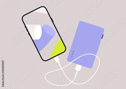 A power bank device with a mobile phone connected with a cable isolated on a plain background
