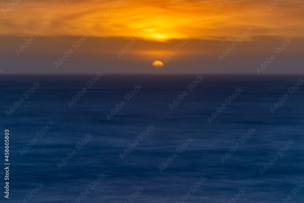time exposure of sunset over the ocean