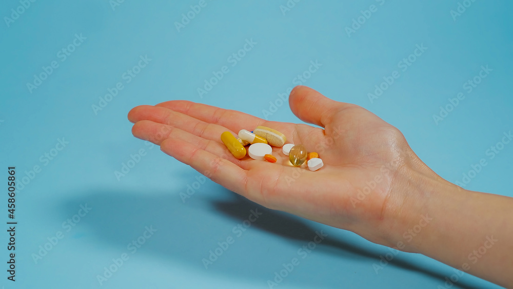 Hand holding Various Pills. Overdose or abuse concept. Medicine Drugs Various medicines. Health care and medical treatment concept. Hand holding Various Pills. Overdose or abuse concept. Medicine Drugs Various medicines. Health care and medical treatment concept.