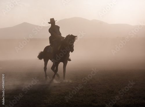 silhouette of a  cowboy on a horse