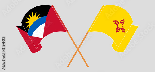Crossed and waving flags of Antigua and Barbuda and the State of New Mexico