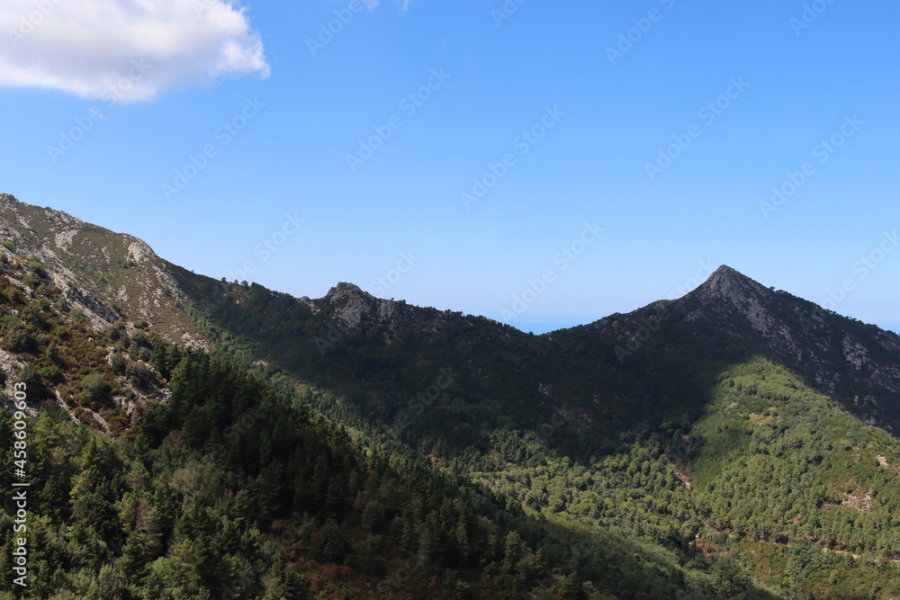 Elba, Italy – September 01, 2021: beautiful places from Elba Island. Aerial  view to the island. Little famous villages near the beaches. Summer tourist places. Clouds and blue sky in the background.