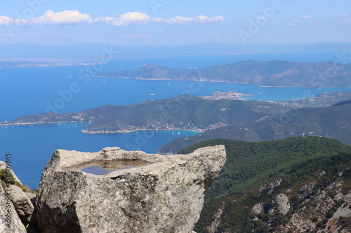 Elba, Italy – September 01, 2021: beautiful places from Elba Island. Aerial view to the island. Little famous villages near the beaches. Summer tourist places. Clouds and blue sky in the background.