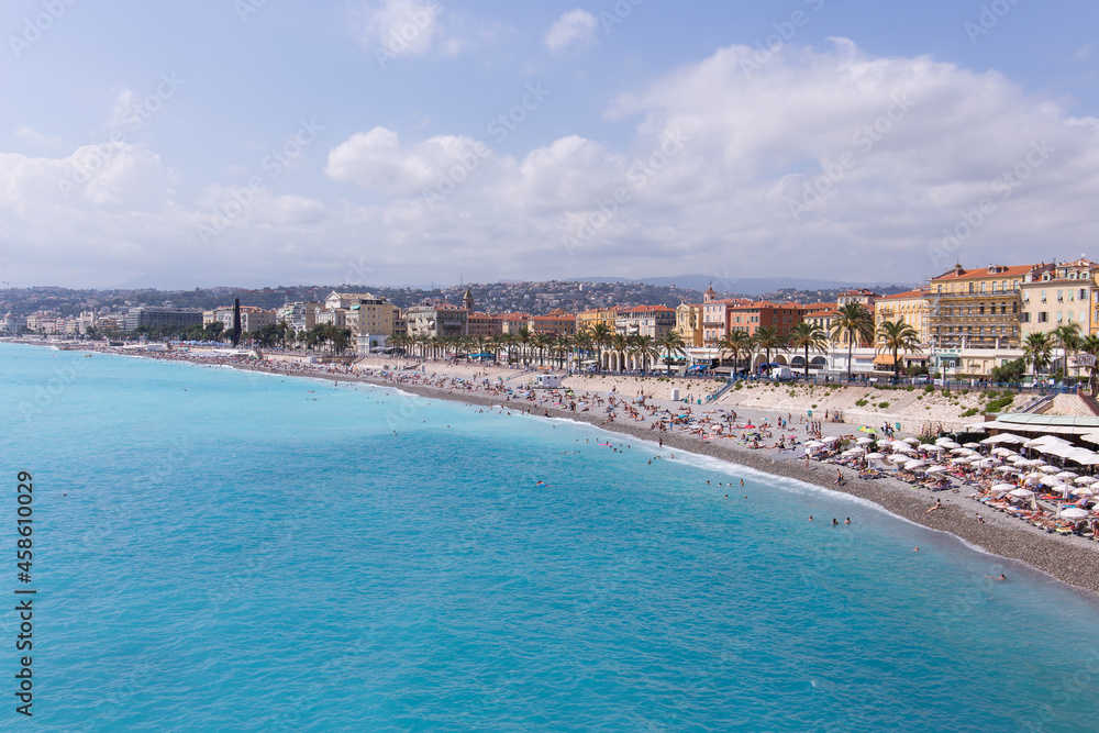 Beach of Nice with lots of tourists during summer