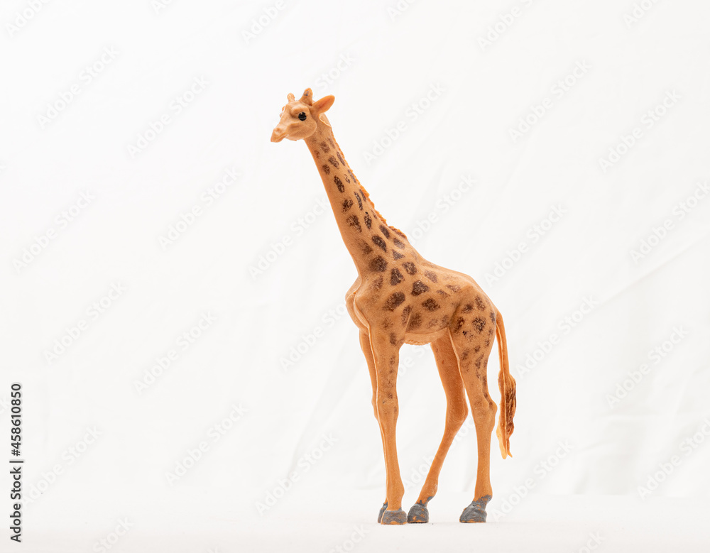 Gothenburg, Sweden - september 11 2021: Plastic toy giraffe on white background.
