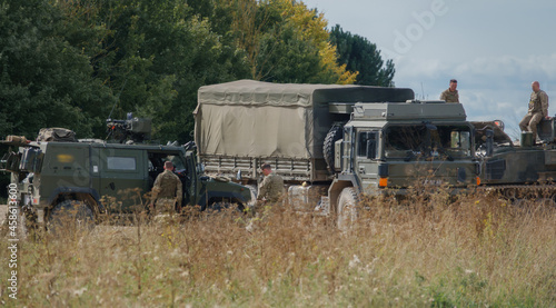 British army soldiers with a Panther CLV, MAN SV 4x4 and a Bulldog FV432 on a military exercise Wilts UK
