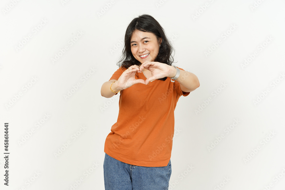 Showing heart shape hand sign of beautiful asian woman Wearing orange T-shirt isolated on white background Showing heart shape hand sign of beautiful asian woman Wearing orange T-shirt isolated on white background