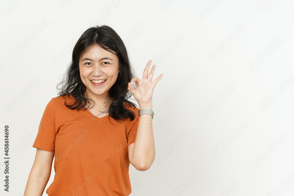 Ok Hand Sign Gesture of beautiful asian woman Wearing orange T-shirt isolated on white background Ok Hand Sign Gesture of beautiful asian woman Wearing orange T-shirt isolated on white background