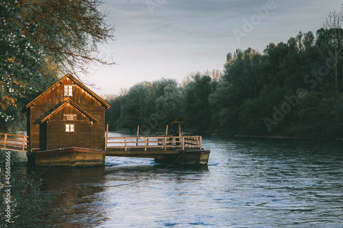 Beautiful old wooden mill on mura river or mlin na muri in the pomurje region of slovenia on a romantic summer sunset