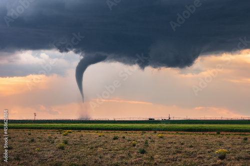 Fototapeta A tornado over a field in Texas