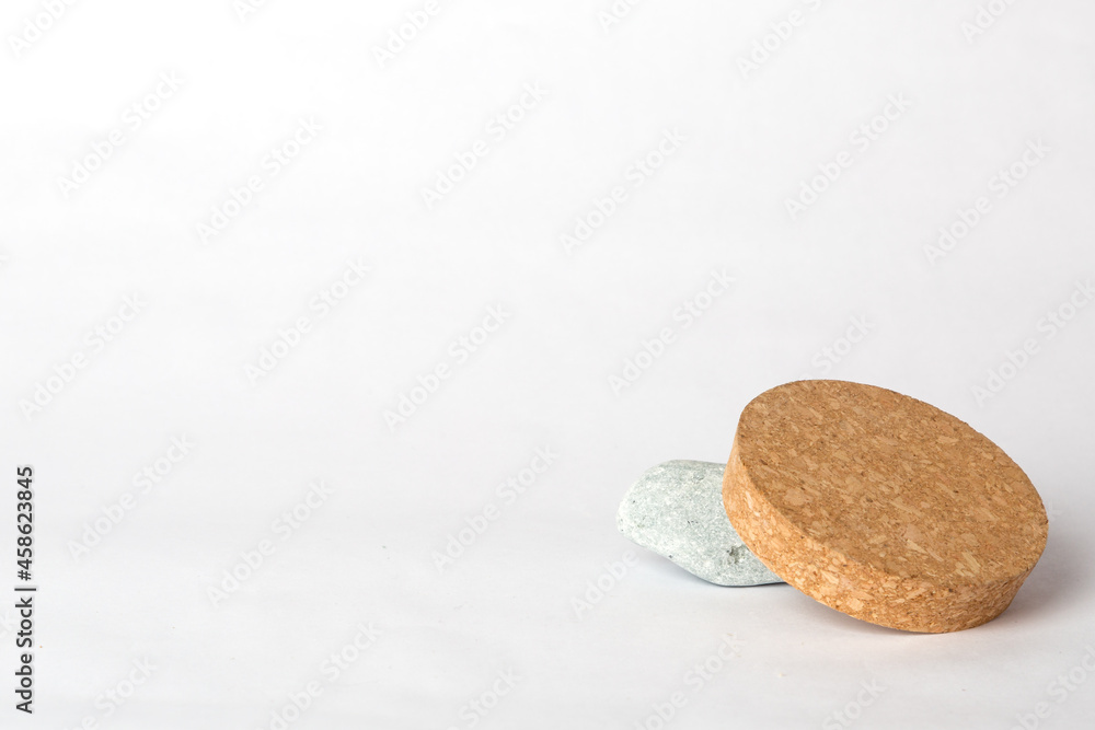 gray stone and cork on a white background gray stone and cork on a white background