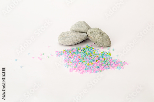gray stones and balls on a white background