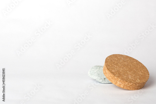 gray stone and cork on a white background