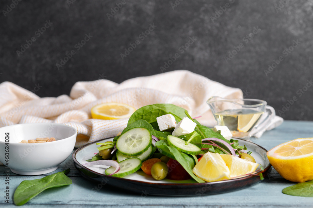 Plate with healthy salad on color wooden background Plate with healthy salad on color wooden background