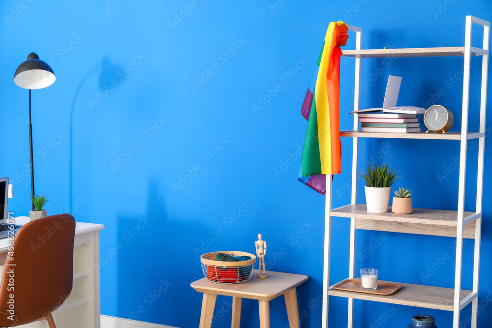 Book shelf with flag of LGBT near color wall Book shelf with flag of LGBT near color wall