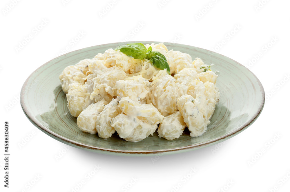 Plate of delicious gnocchi with creamy sauce on white background Plate of delicious gnocchi with creamy sauce on white background