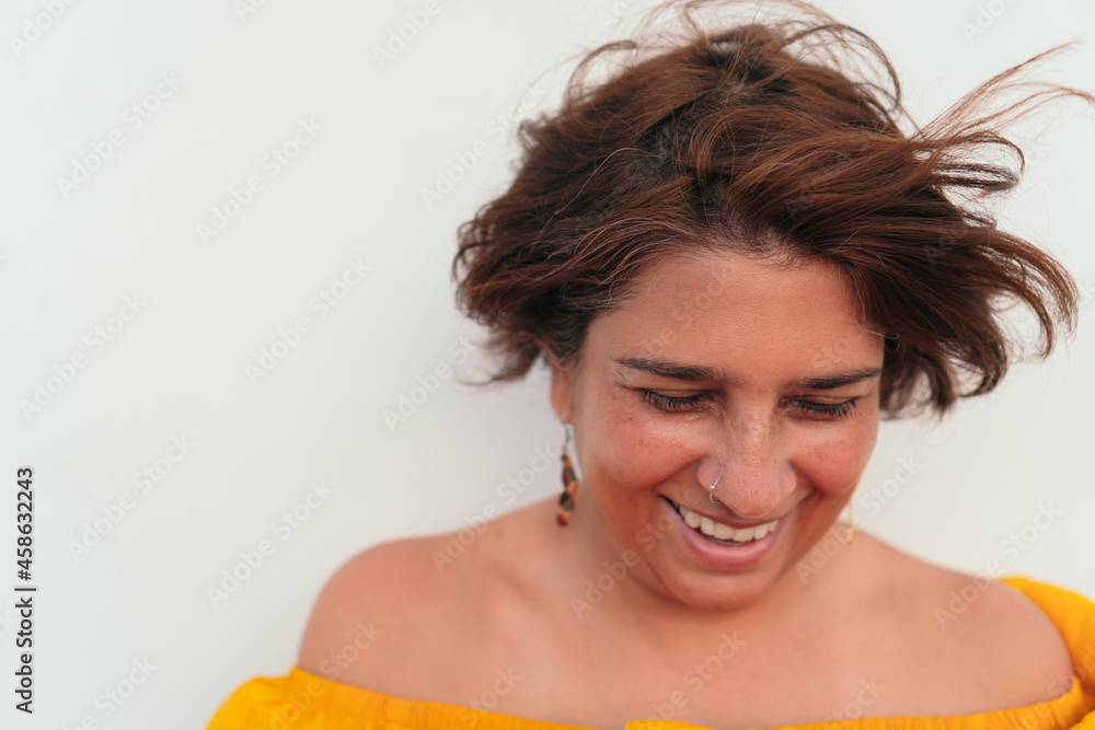 Obraz premium Mature woman smiling with white background.