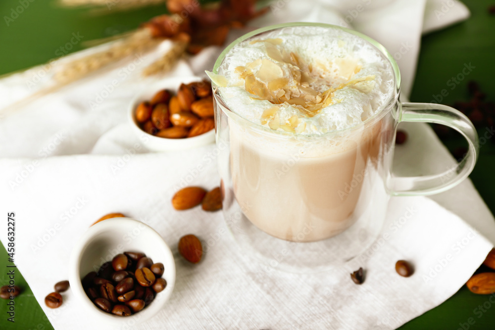 Glass cup of tasty almond latte on table Glass cup of tasty almond latte on table
